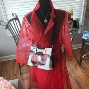 Sheer coat. Hand bag . Jewelry